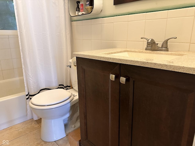 1433 N Colorado Ave, Indianapolis, IN 46201 - full bath featuring vanity, shower / bath combo, tile walls, and tile patterned flooring