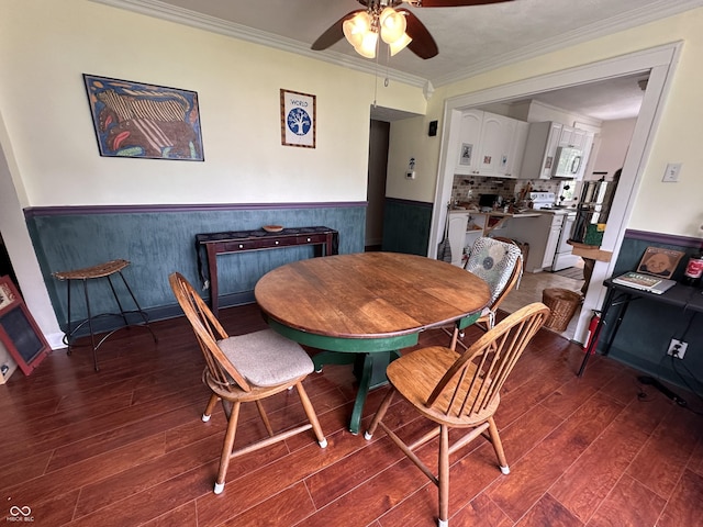 1433 N Colorado Ave, Indianapolis, IN 46201 - dining room with wainscoting, wood finished floors, ceiling fan, and crown molding