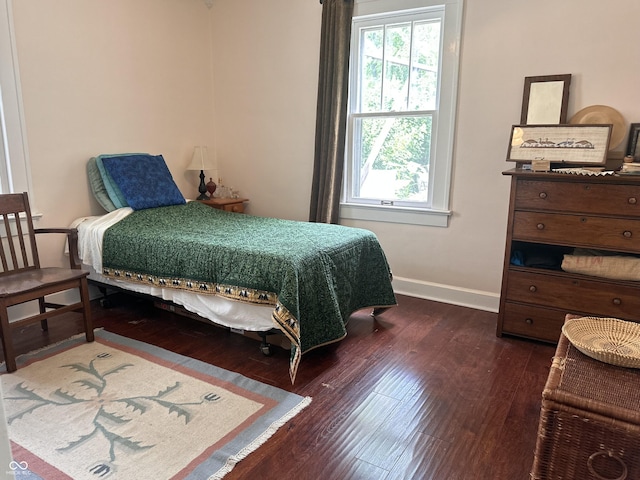 1433 N Colorado Ave, Indianapolis, IN 46201 - bedroom featuring multiple windows and dark wood finished floors