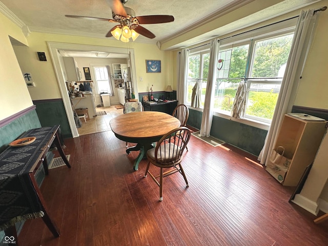 1433 N Colorado Ave, Indianapolis, IN 46201 - dining space with ornamental molding, wood finished floors, wainscoting, and a ceiling fan