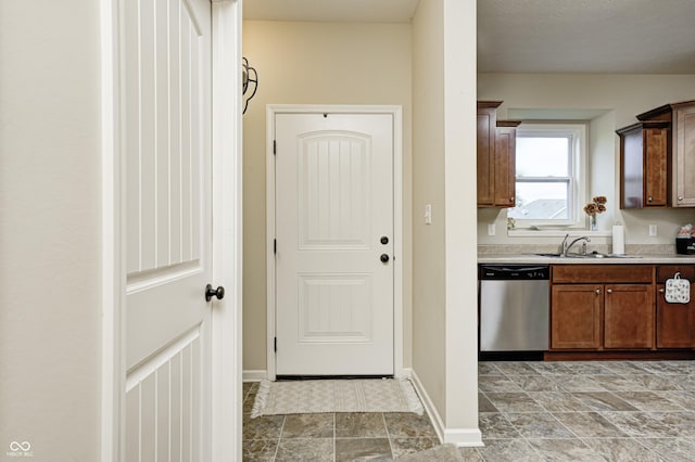 1331 Mccormicks Cir, Danville, IN 46122 - kitchen with dishwasher, light countertops, and stone finish floors
