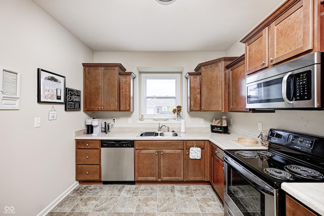 1331 Mccormicks Cir, Danville, IN 46122 - kitchen with stainless steel appliances, light countertops, and brown cabinets