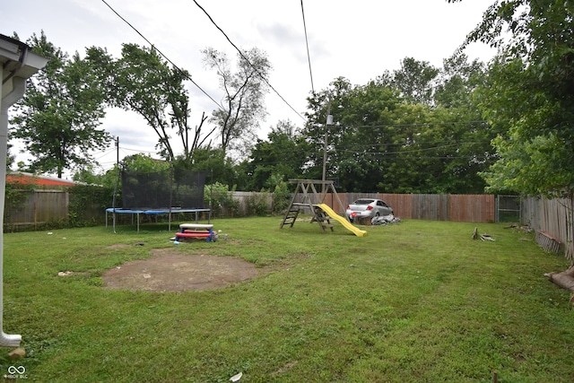 2638 S Mcclure St, Indianapolis, IN 46241 - fenced backyard with a trampoline and a playground