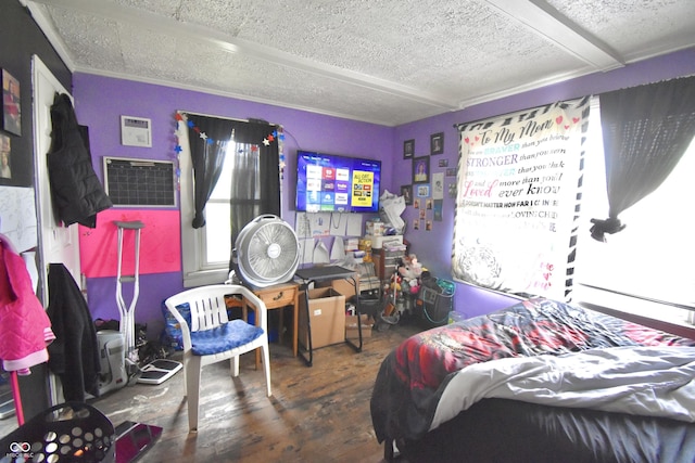 2638 S Mcclure St, Indianapolis, IN 46241 - bedroom featuring wood-type flooring, a textured ceiling, and an AC wall unit