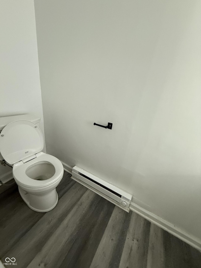 8434 Meadowlark Dr, Indianapolis, IN 46226 - bathroom with a baseboard radiator and wood finished floors