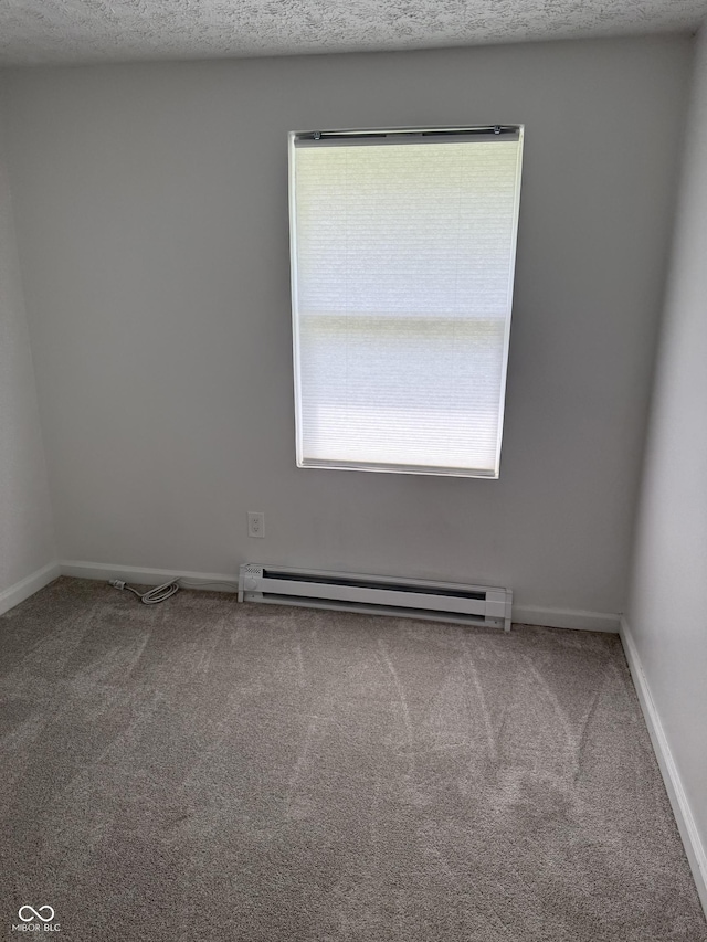 8434 Meadowlark Dr, Indianapolis, IN 46226 - unfurnished room featuring carpet floors and a baseboard heating unit