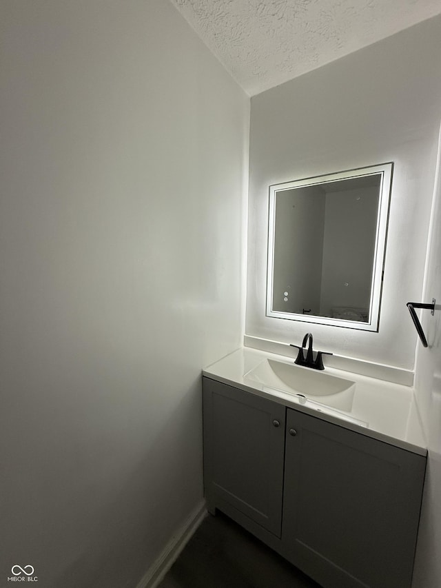 8434 Meadowlark Dr, Indianapolis, IN 46226 - bathroom with a textured ceiling and vanity