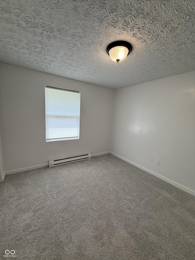 8434 Meadowlark Dr, Indianapolis, IN 46226 - carpeted spare room with a baseboard heating unit and a textured ceiling