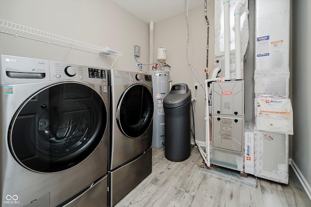 6644 Aberdeen Dr, Mccordsville, IN 46055 - washroom with heating unit, washer and dryer, and wood finished floors