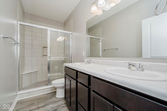 6644 Aberdeen Dr, Mccordsville, IN 46055 - full bathroom featuring double vanity, a shower stall, and wood finished floors