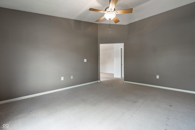 246 Legends Creek Way Apt 207, Indianapolis, IN 46229 - spare room featuring ceiling fan, carpet, and a high ceiling