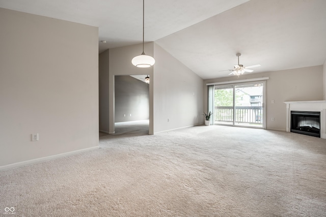 246 Legends Creek Way Apt 207, Indianapolis, IN 46229 - unfurnished living room with carpet, lofted ceiling, a glass covered fireplace, and a ceiling fan