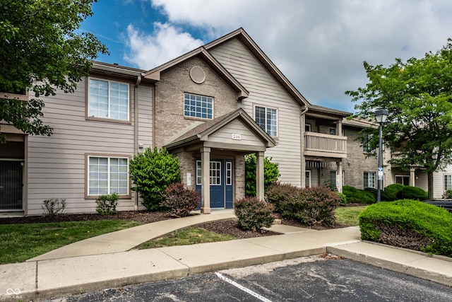 246 Legends Creek Way Apt 207, Indianapolis, IN 46229 - view of front of home with uncovered parking and brick siding