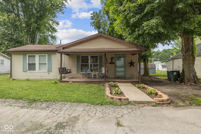 13 S 4th St, Cambridge City, IN 47327 - view of front of house with covered porch and a front lawn