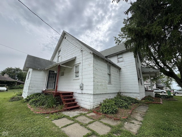 401 S W St, Kempton, IN 46049 - view of home's exterior featuring a lawn and roof with shingles