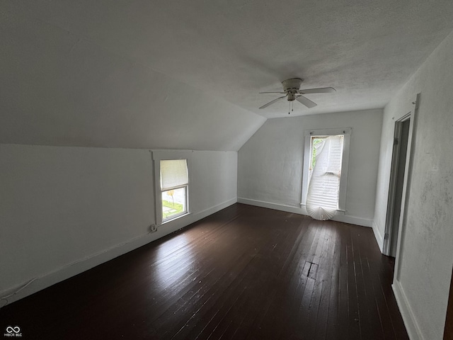 401 S W St, Kempton, IN 46049 - bonus room with dark wood-style flooring, ceiling fan, lofted ceiling, and a textured ceiling