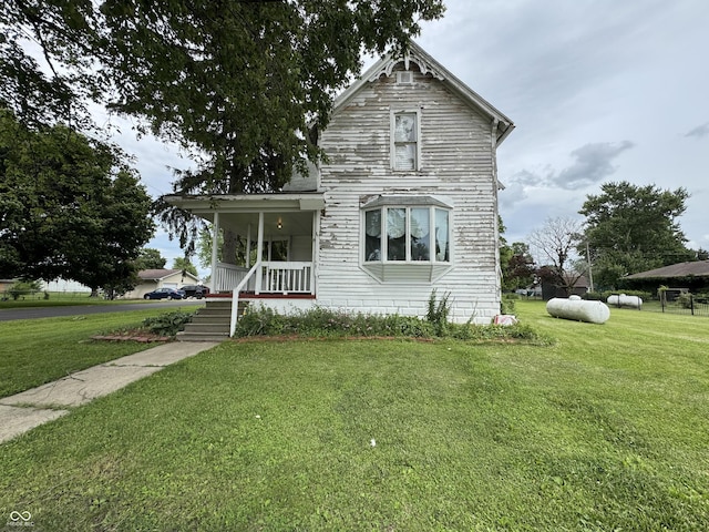 401 S W St, Kempton, IN 46049 - victorian home with a front yard and covered porch