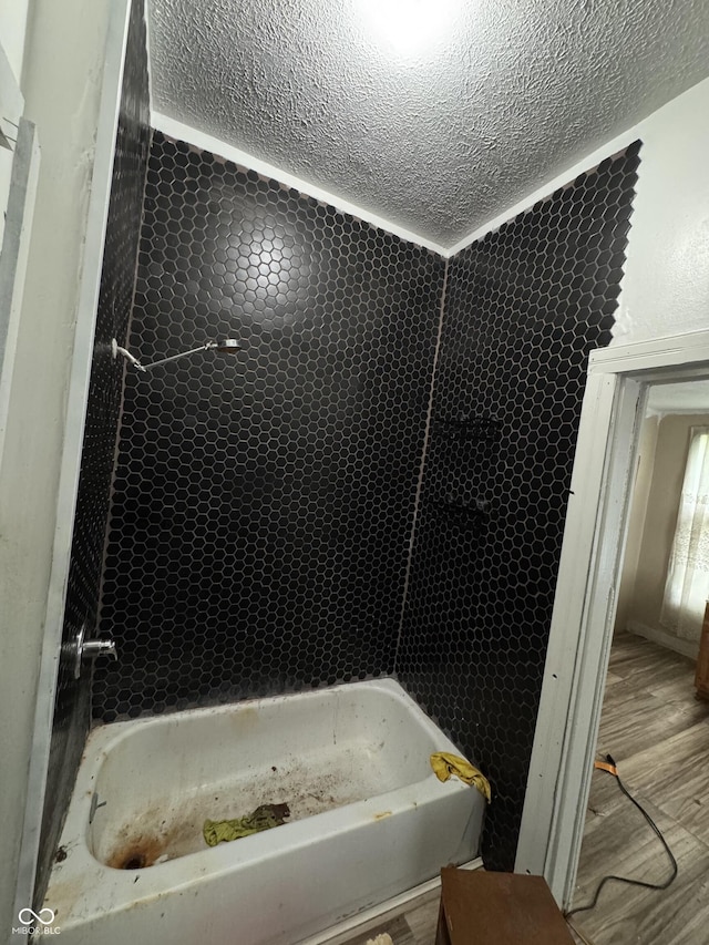 401 S W St, Kempton, IN 46049 - full bathroom with a textured ceiling, shower / tub combination, and wood finished floors