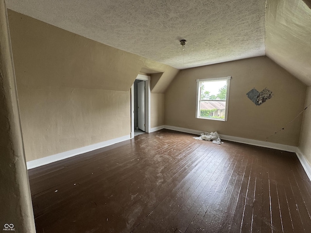 401 S W St, Kempton, IN 46049 - bonus room featuring wood-type flooring, lofted ceiling, and a textured ceiling