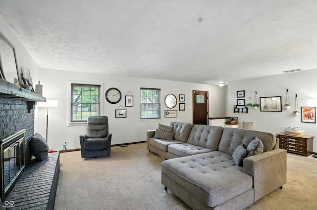 610 Front Royal Dr, Indianapolis, IN 46227 - living room with light colored carpet, a brick fireplace, and a textured ceiling