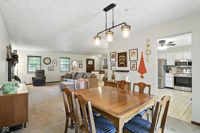 610 Front Royal Dr, Indianapolis, IN 46227 - dining space featuring ceiling fan, a textured ceiling, and light carpet