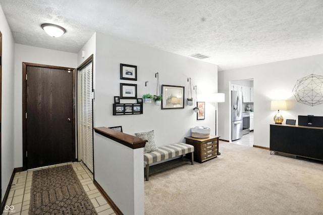 610 Front Royal Dr, Indianapolis, IN 46227 - entryway with a textured ceiling and baseboards