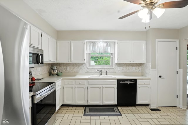 610 Front Royal Dr, Indianapolis, IN 46227 - kitchen featuring stainless steel appliances, white cabinets, backsplash, light countertops, and ceiling fan