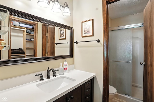 610 Front Royal Dr, Indianapolis, IN 46227 - full bathroom featuring a stall shower, vanity, and a textured ceiling