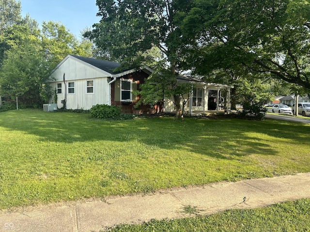 1908 Tennyson Dr, Clarksville, IN 47129 - view of front of property with a front lawn and board and batten siding