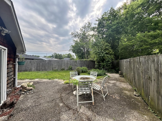 1908 Tennyson Dr, Clarksville, IN 47129 - fenced backyard featuring a patio area and outdoor dining area