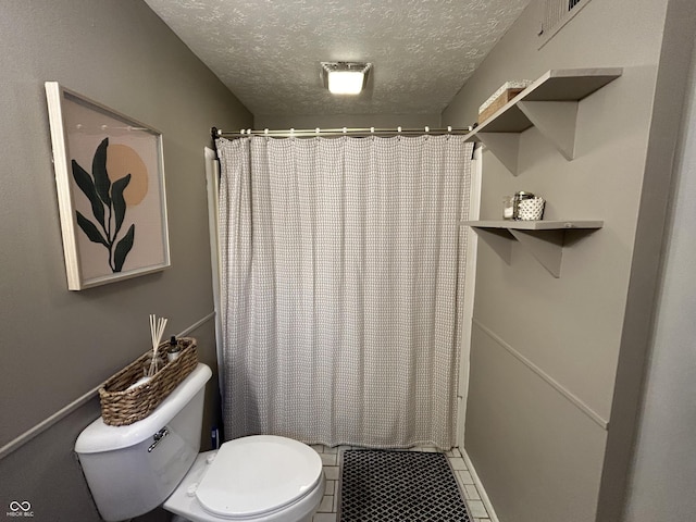 1908 Tennyson Dr, Clarksville, IN 47129 - bathroom featuring a textured ceiling, a shower with shower curtain, and tile patterned flooring