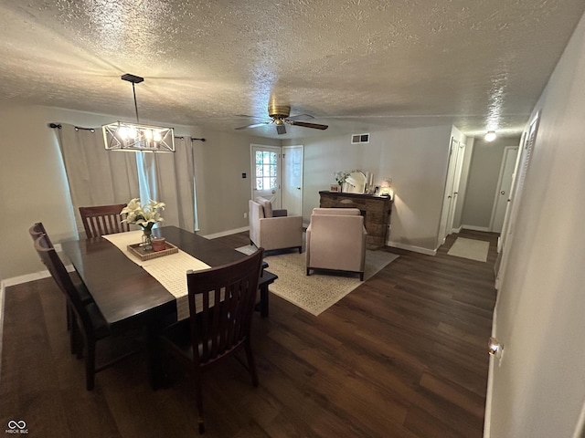 1908 Tennyson Dr, Clarksville, IN 47129 - dining space featuring a textured ceiling, wood finished floors, ceiling fan, and a chandelier