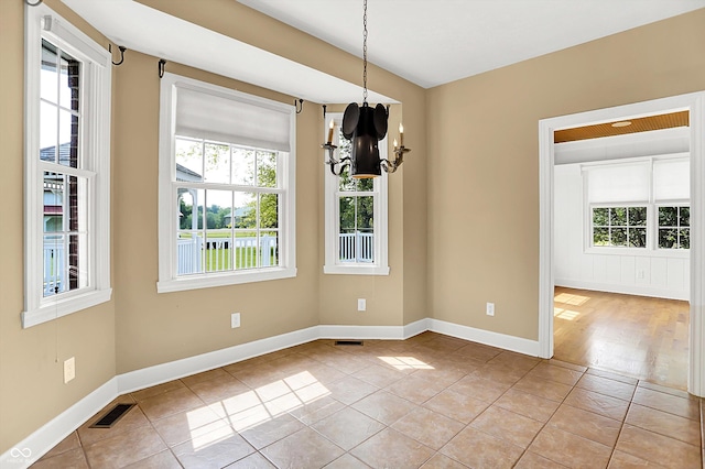 11250 N 600 W, Fountaintown, IN 46130 - unfurnished dining area featuring plenty of natural light, a chandelier, and light tile patterned floors