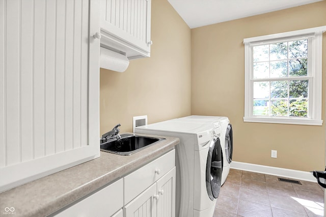 11250 N 600 W, Fountaintown, IN 46130 - washroom featuring cabinet space, washer and dryer, and light tile patterned floors