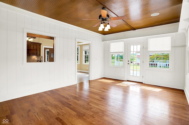 11250 N 600 W, Fountaintown, IN 46130 - unfurnished room with a ceiling fan, wood finished floors, crown molding, wood ceiling, and wood walls