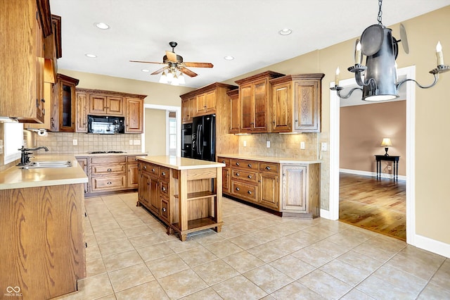 11250 N 600 W, Fountaintown, IN 46130 - kitchen with black microwave, refrigerator, ceiling fan, light tile patterned floors, and light countertops