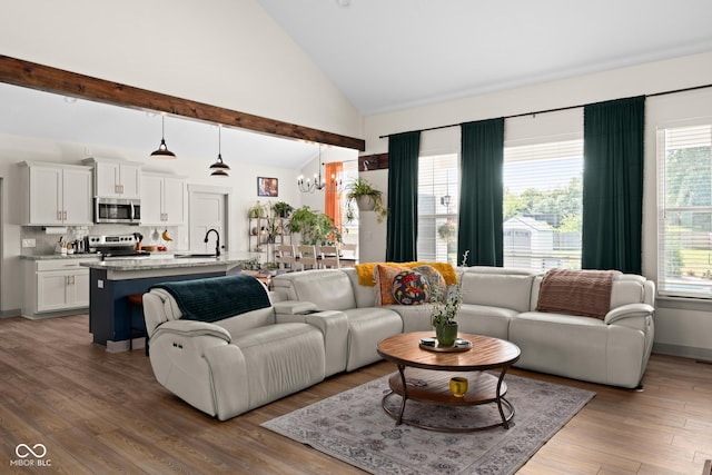320 Briar Hill Dr, Whiteland, IN 46184 - living room featuring a chandelier, wood finished floors, and high vaulted ceiling
