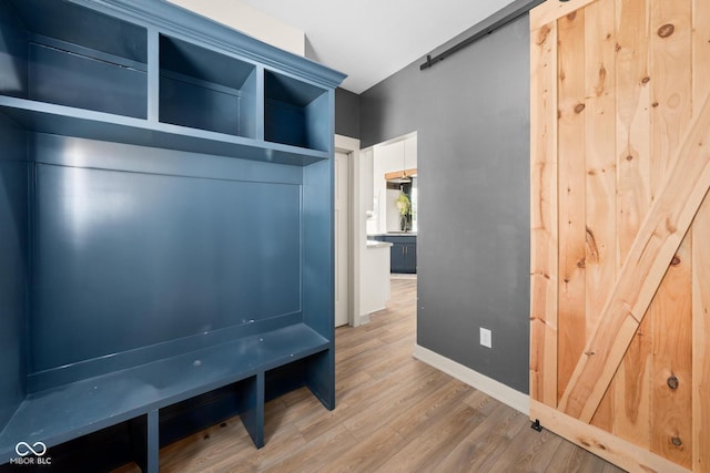 320 Briar Hill Dr, Whiteland, IN 46184 - mudroom featuring a barn door and wood finished floors