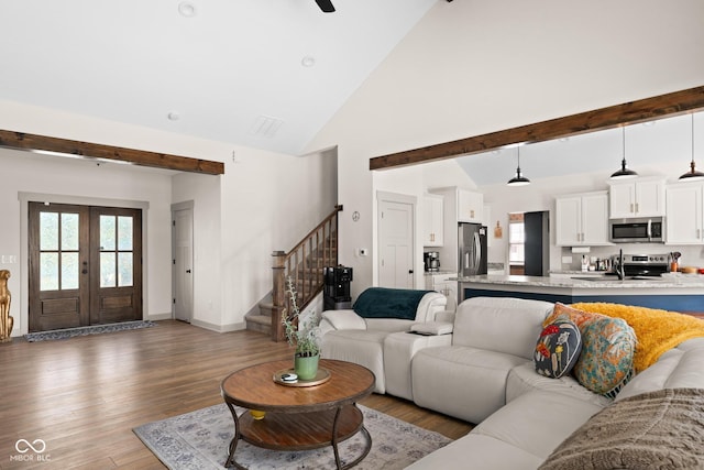320 Briar Hill Dr, Whiteland, IN 46184 - living area with stairs, high vaulted ceiling, light wood-type flooring, french doors, and beamed ceiling