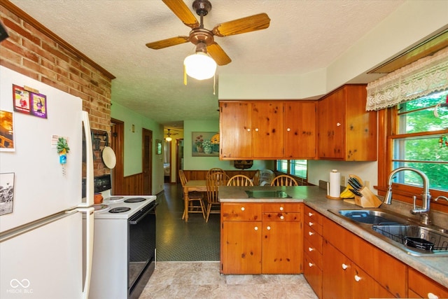 2808 Woodside Dr, Plainfield, IN 46168 - kitchen featuring white appliances, a textured ceiling, brown cabinets, ceiling fan, and a peninsula
