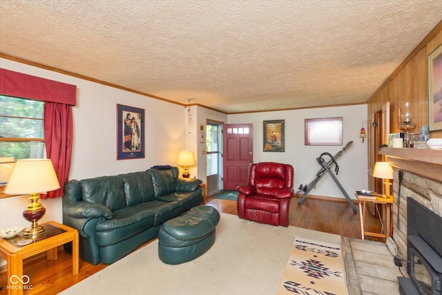 2808 Woodside Dr, Plainfield, IN 46168 - living room featuring ornamental molding, wood finished floors, a fireplace, and a textured ceiling