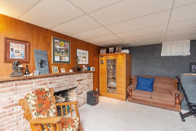 2808 Woodside Dr, Plainfield, IN 46168 - carpeted living room with a paneled ceiling, wooden walls, and a fireplace