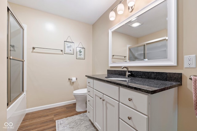 3450 Clay Rd, North Salem, IN 46165 - bathroom with wood finished floors, vanity, and bath / shower combo with glass door