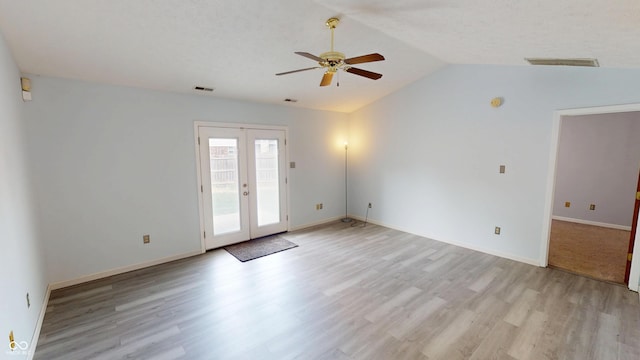 6640 Chipping Ct, Indianapolis, IN 46268 - unfurnished room with ceiling fan, french doors, light wood-style floors, and vaulted ceiling