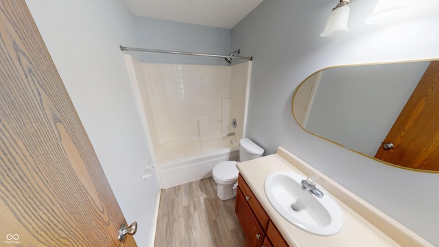 6640 Chipping Ct, Indianapolis, IN 46268 - bathroom with wood finished floors, vanity, and tub / shower combination