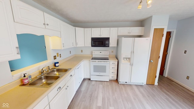 6640 Chipping Ct, Indianapolis, IN 46268 - kitchen with white appliances, light wood-type flooring, white cabinetry, and light countertops