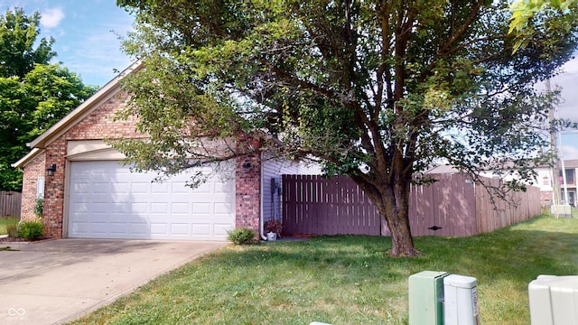 6640 Chipping Ct, Indianapolis, IN 46268 - view of home's exterior featuring brick siding, concrete driveway, and an attached garage