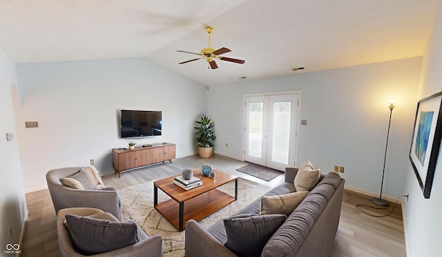 6640 Chipping Ct, Indianapolis, IN 46268 - living room featuring a ceiling fan, wood finished floors, lofted ceiling, arched walkways, and french doors