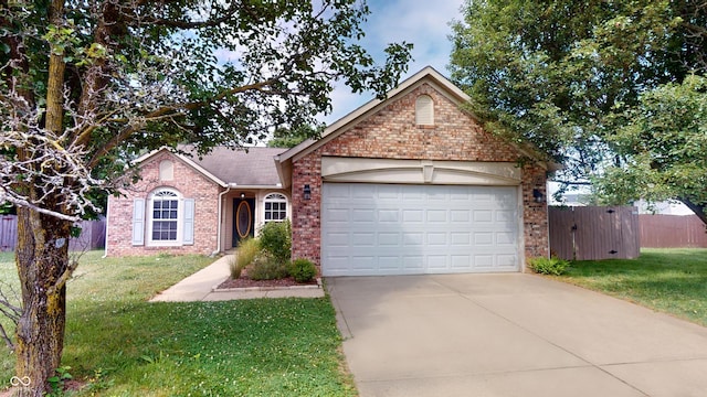 6640 Chipping Ct, Indianapolis, IN 46268 - view of front of property with brick siding, an attached garage, and driveway