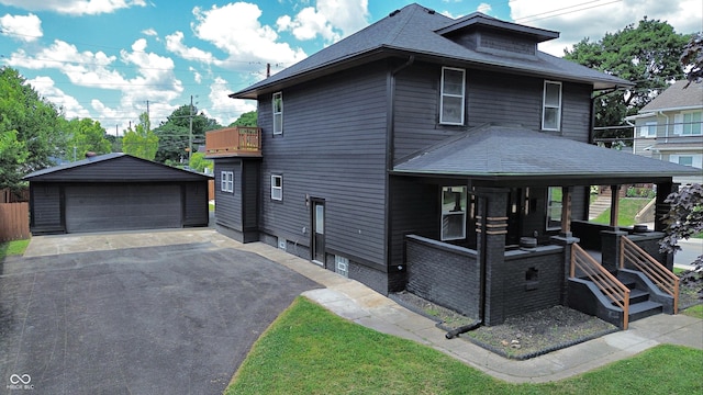 3962 Graceland Ave, Indianapolis, IN 46208 - view of front of home featuring an outbuilding, a shingled roof, and a garage